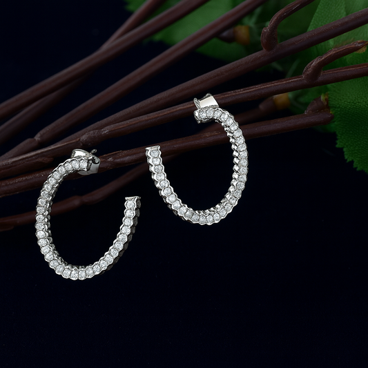 Open oval pattern with studded stone earring