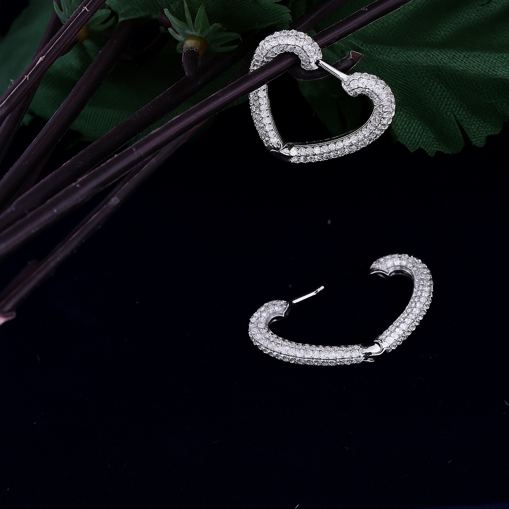 Heart shapped earring with studded stone